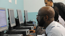 Man at computer job training